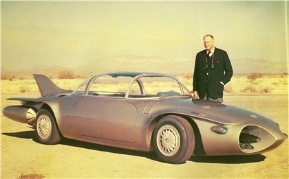 Harley Earl poses with the Firebird II