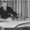 The beautiful X-1000 was designed at the request of Ford's vice president and general manager of styling George Walker, shown here with a 3/8-scale model of the design