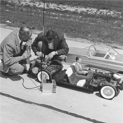Tremulis and Romeyne Hammond, a top notch model maker, adjusting the La Tosca 3/8ths scale model. It was fitted with a radio-controllled motor that was controllable from over a mile away.  Headlights, brake lights and turn indicators were all controlled by radio.