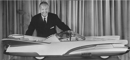The beautiful X-1000 was designed at the request of Ford's vice president and general manager of styling George Walker, shown here with a 3/8-scale model of the design