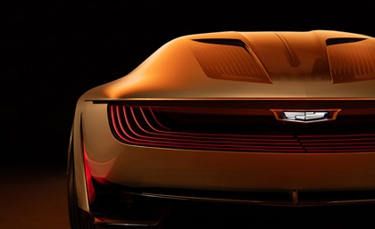 Rear view of Opulent Velocity concept vehicle with signature lighting and lit Cadillac badge.