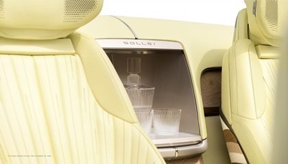 Interior view of Cadillac SOLLEI concept vehicle with Sunburst Motif pattern seats and crystal glass accessory inside integrated beverage chiller