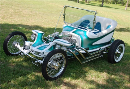 This is an exact replica of Ed Big Daddy Roths first radical show rod the Outlaw. Fritz did a complete build and paint using all of the hard to find parts Ed had used.