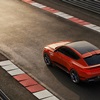 The aerodynamic fluidity is complemented by an upper rear spoiler and spoiler lip on the elliptical concave ducktail, with rear lamps that complete the Two Lines signature at the rear.