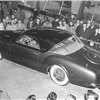 The 1951 Chrysler K-310 concept car had a dummy spare tire outline on the trunk. Dubbed the "toilet seat," it would show up on later Exner production designs.