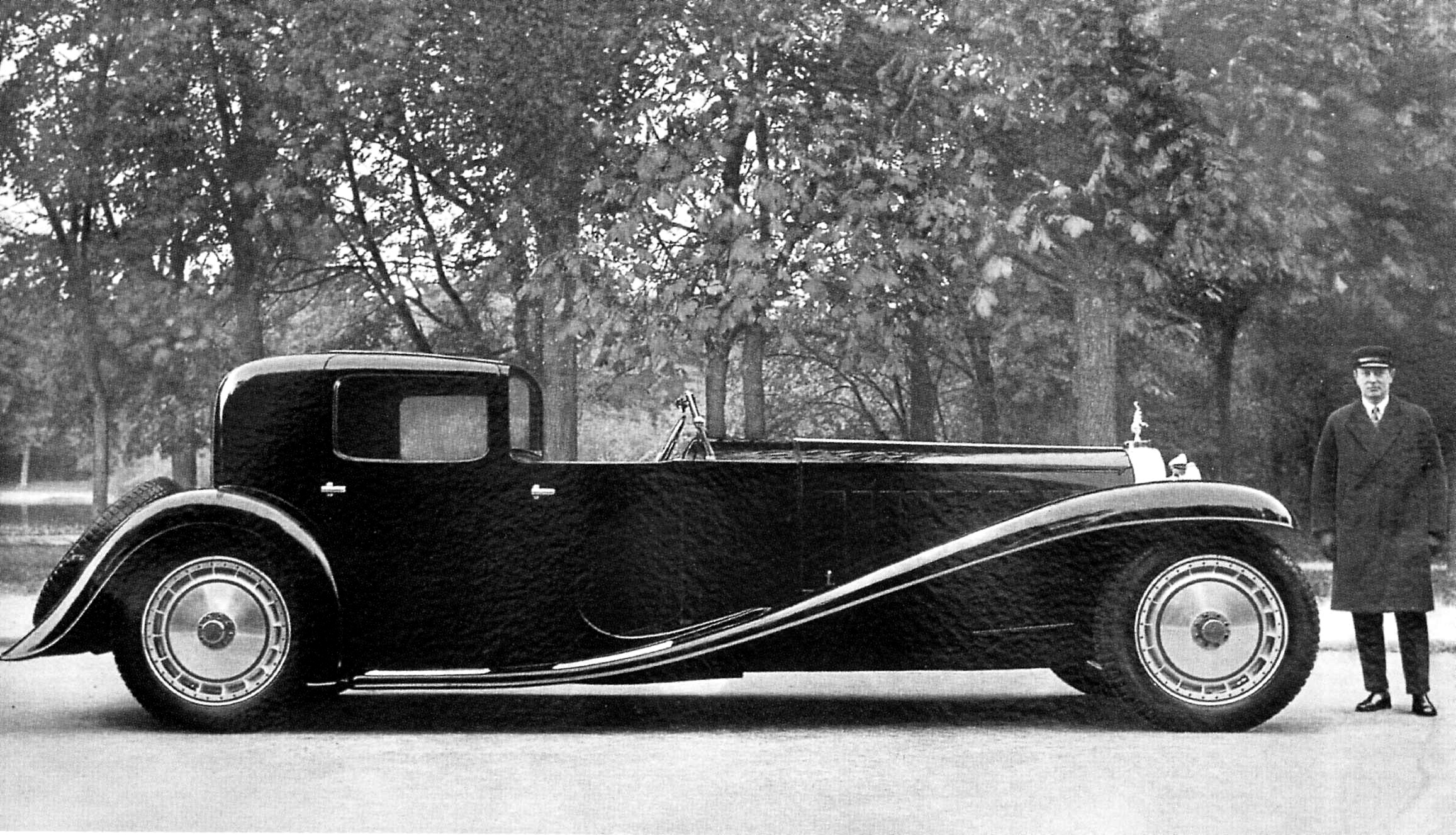 Ettore Bugatti's personal car, the Type 41 Royale Coupe Napoleon with family chauffeur.