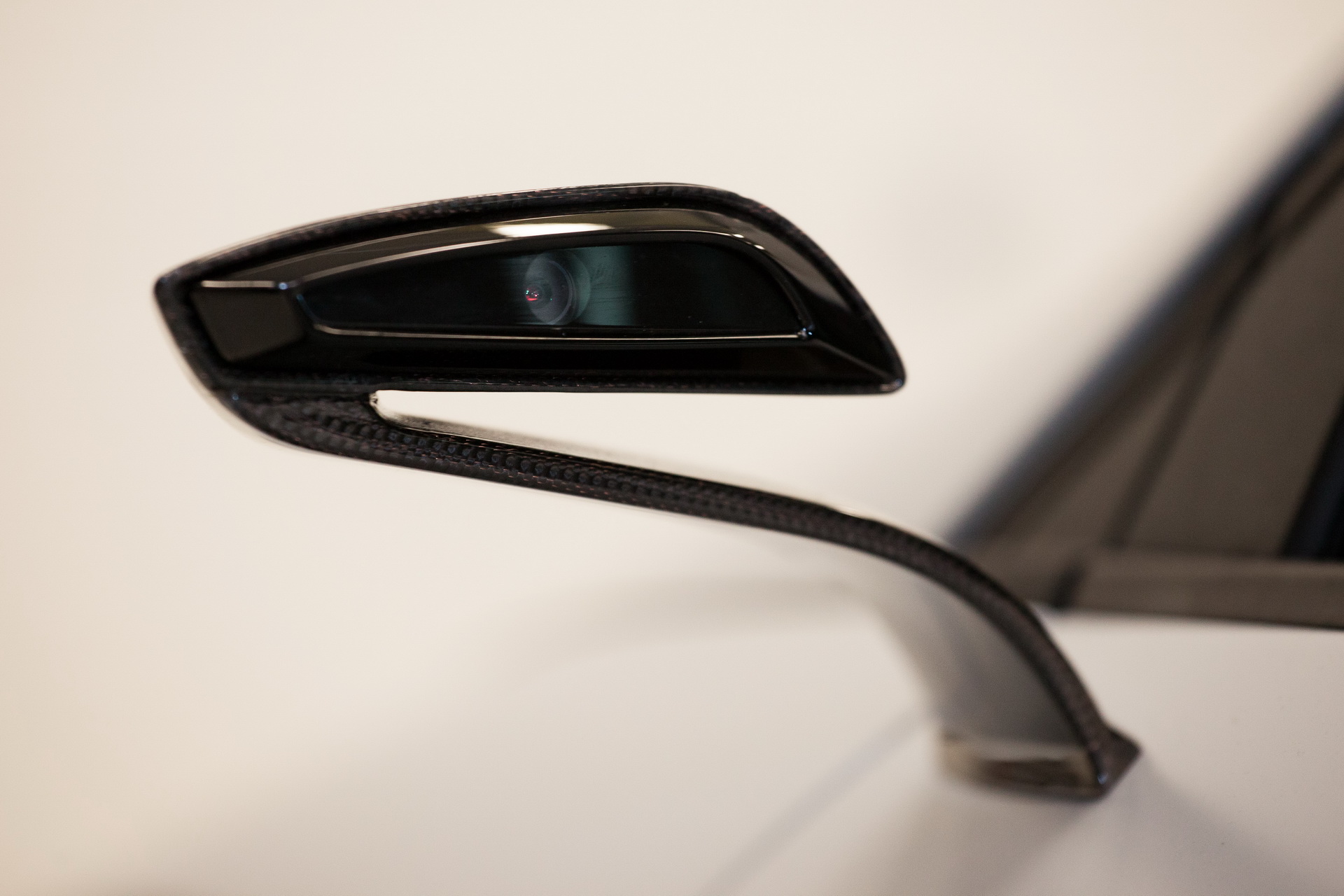 The door mirrors were replaced with mini cameras to make the car more dynamic