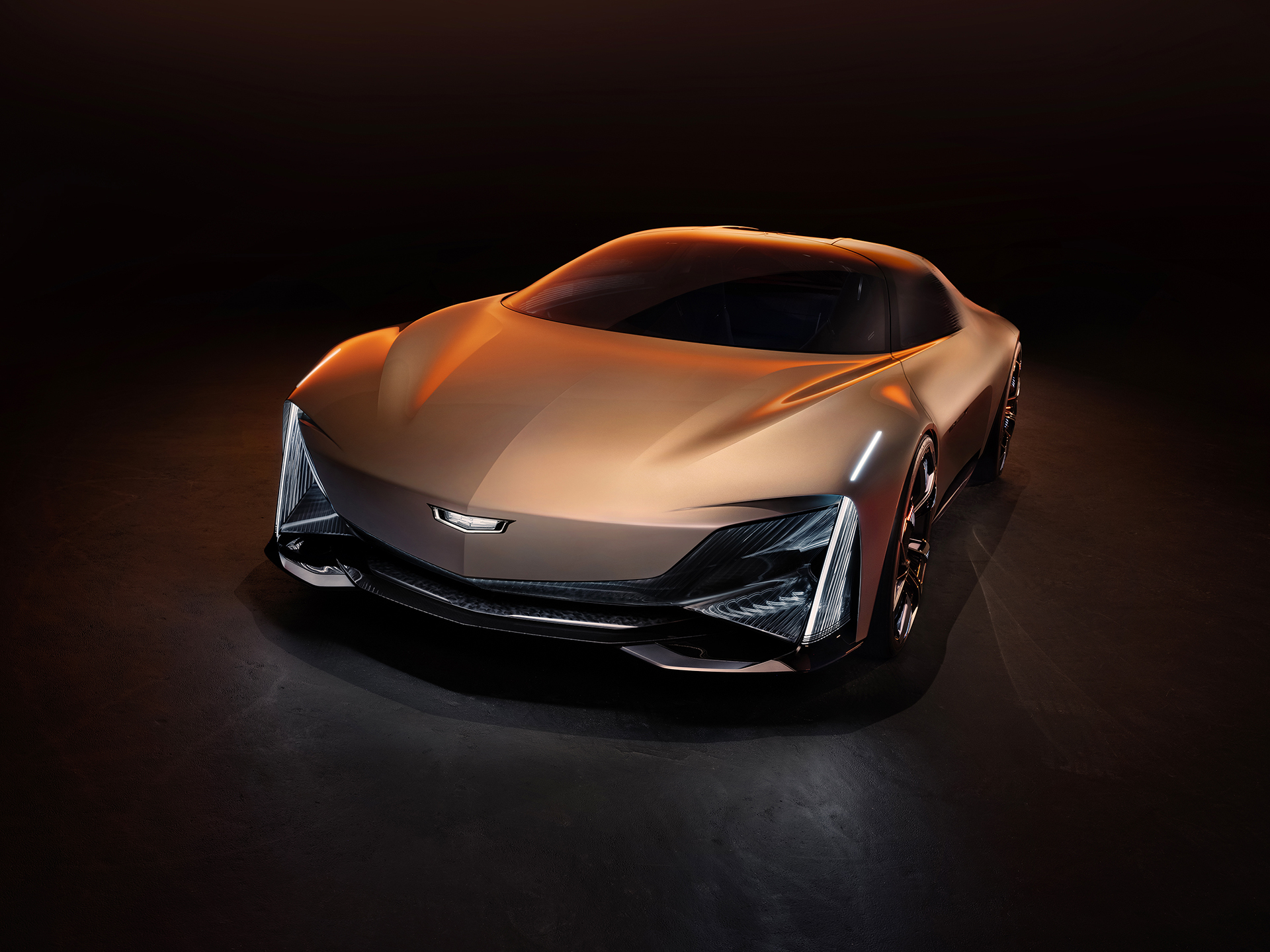 Front 3/4 view of Cadillac Opulent Velocity concept vehicle in Gilded Pearl exterior color.